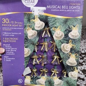 Christmas Musical Bell String Lights with Clear Bells And Gold Bows.